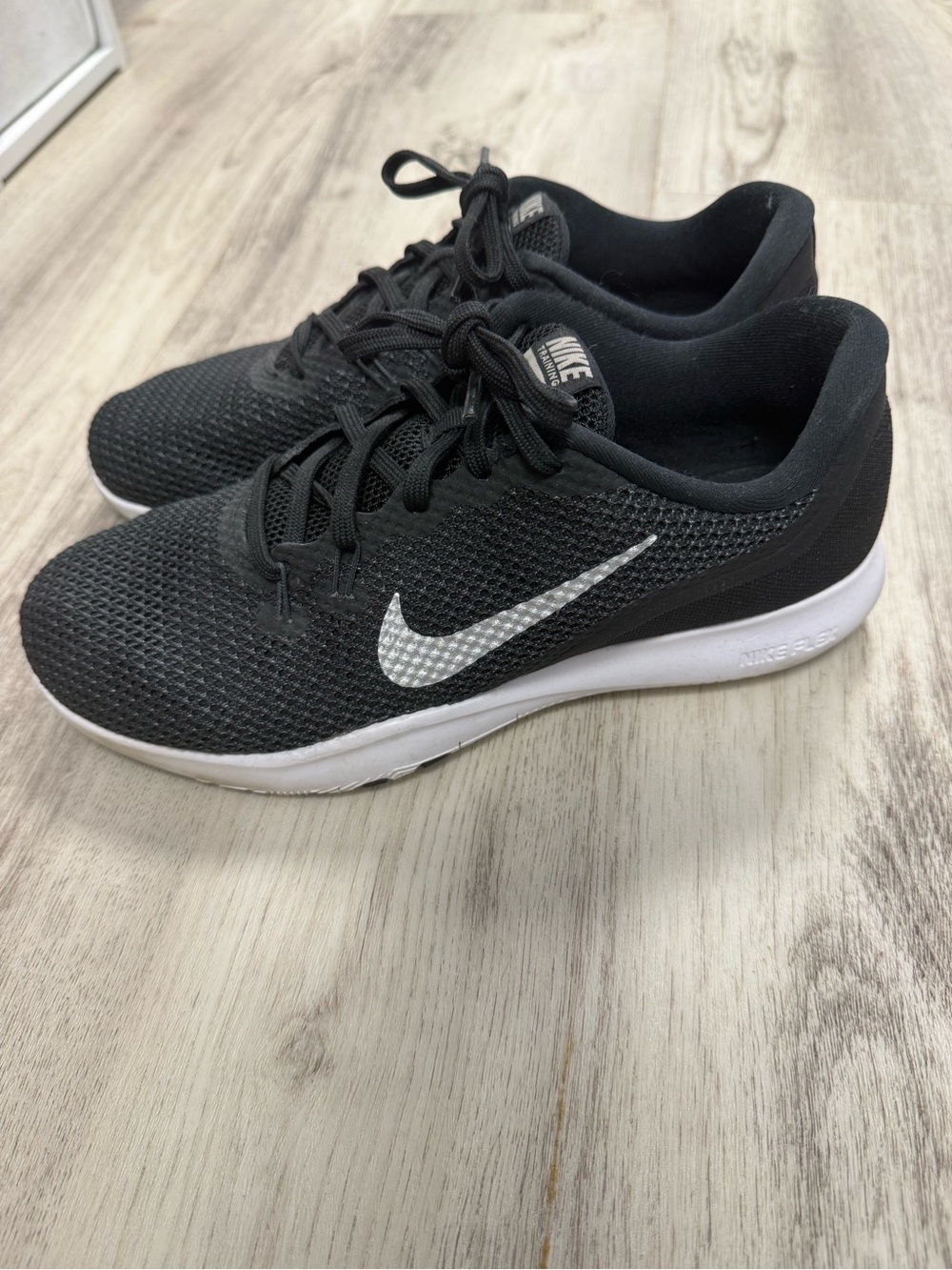 Nike Woman’s Black Mesh Athletic Sneakers with White Swoosh